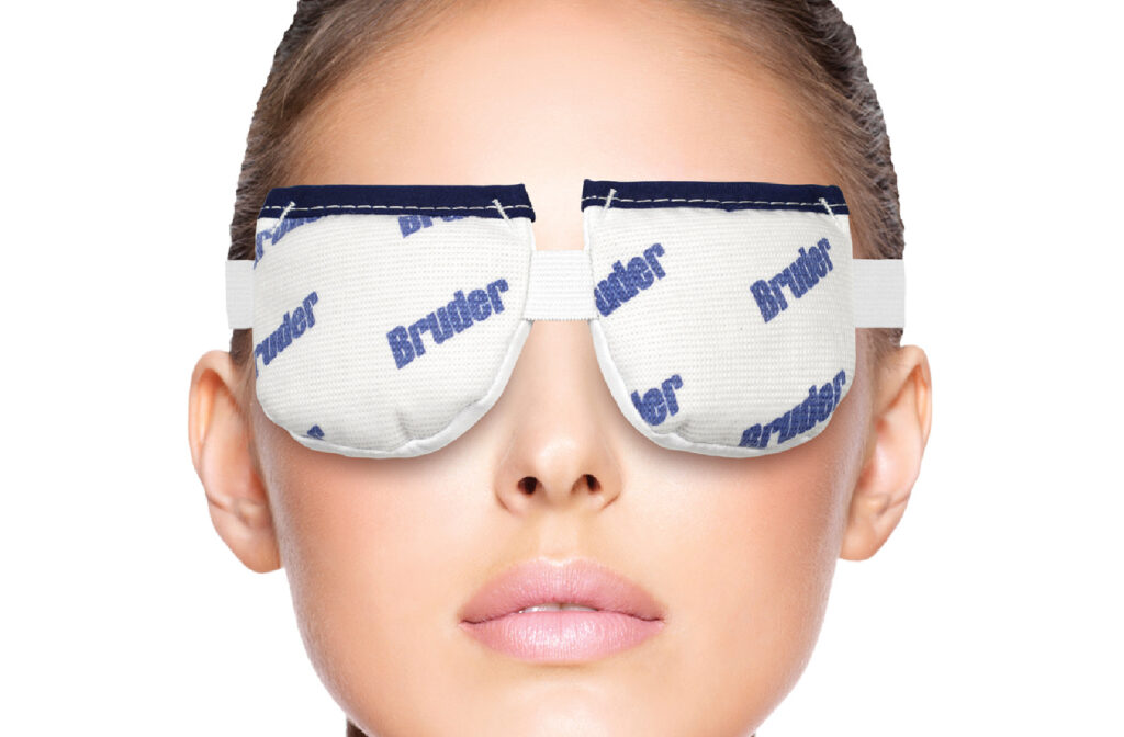 A close up of a woman wearing a bruder eye mask to help with her dry eye disease.