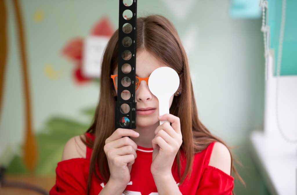 A child using tools during her vision therapy appointment at her optometrist's office