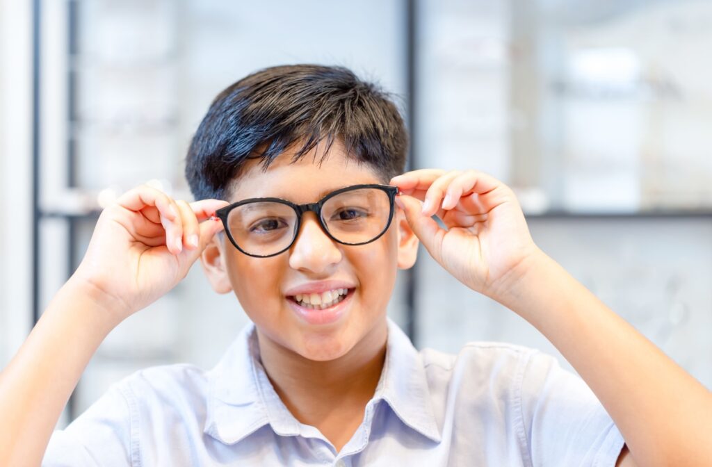 Young child wearing glasses as a common solution to vision impairment problems