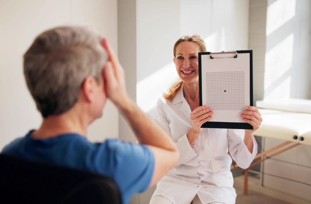 An optometrist uses an Amsler Grid to evaluate a patient's central vision.