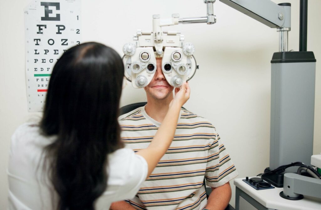 An optometrist giving a person a comprehensive eye exam