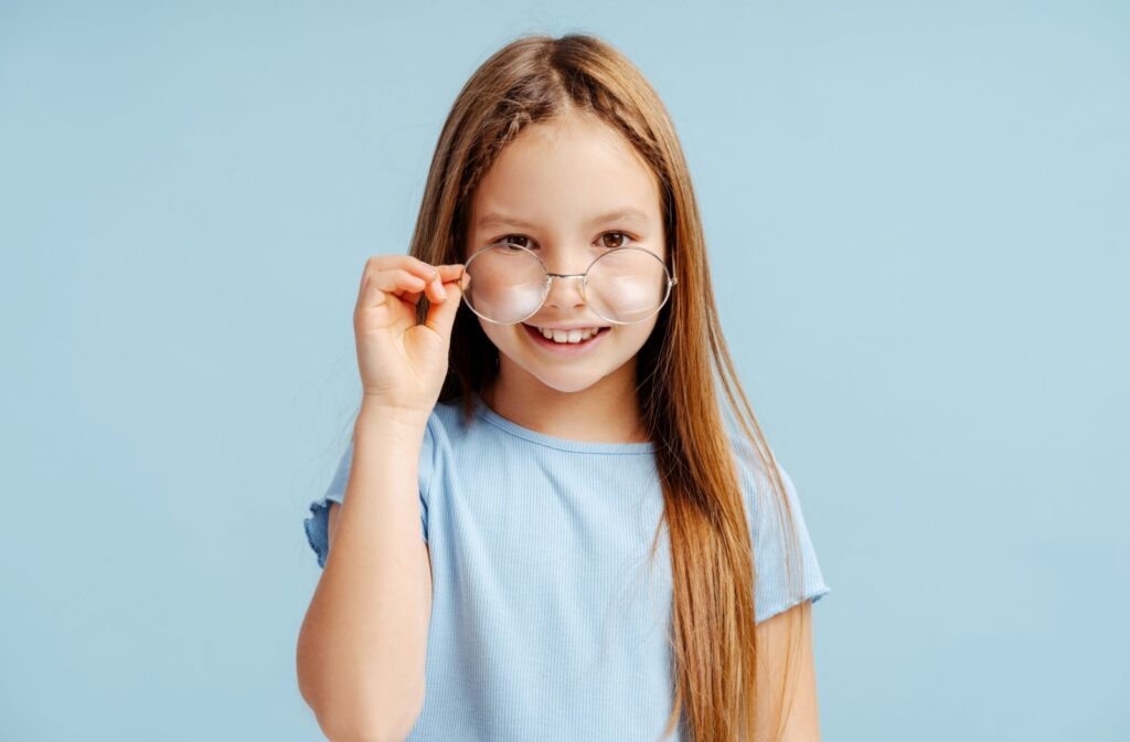 A child wearing a pair of thin framed glasses for their myopia